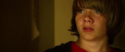 This kid's expression does not change for the duration of the movie: he constantly looks like he's smooshed into a glass door.